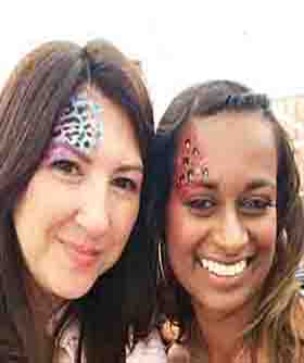 Two lady adults with face painting