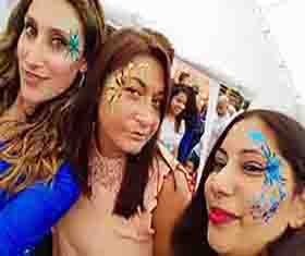 Three ladies with faces painted